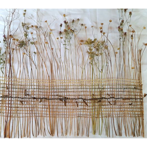 'How to Weave a Meadow ', a large woven piece made from dried meadow flowers woven together with various hand twined plant fibres.