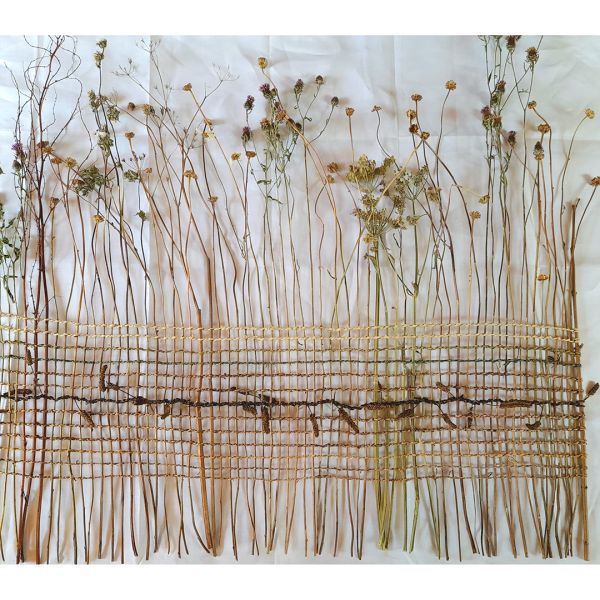 'How to Weave a Meadow ', a large woven piece made from dried meadow flowers woven together with various hand twined plant fibres.